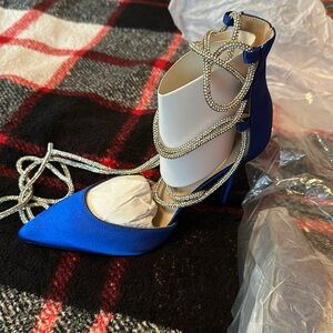 Blue long bedazzled tie up straps heels. Pointed toe. Size 8.